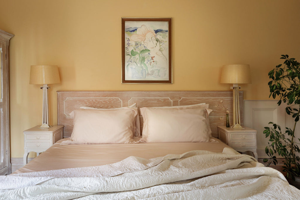 Bed draped with luxury linens from Inish Living in a neutral colour. 