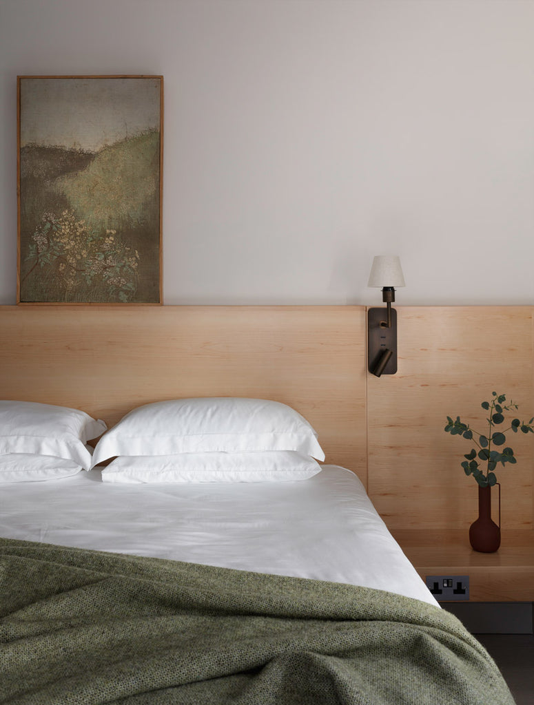 Bed made with Inish Living 100% TENCEL Lyocell bed linen with green throw